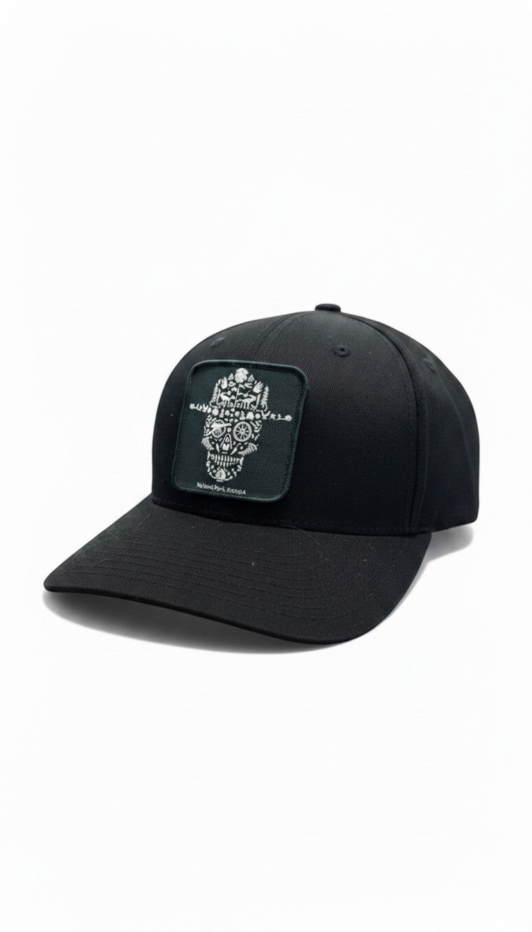 Moove Headwear black fitted National Park Service ranger hat with a square patch featuring a skull design made of nature elements.