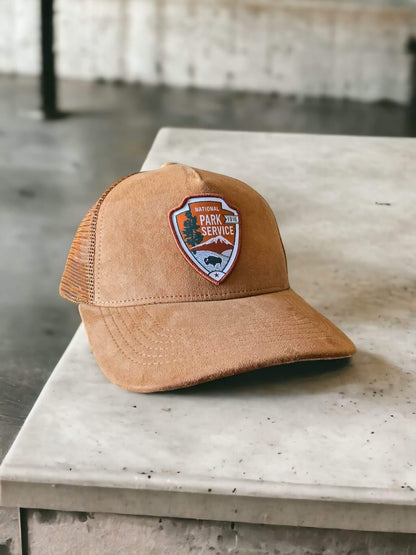 Moove Headwear tan suede National Park Service snapback hat with embroidered NPS emblem and mesh back panels.