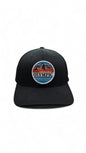 Moove Headwear black Flexfit cap with Olympic National Park mountain logo patch. Comfortable stretch-fit for outdoor adventures.