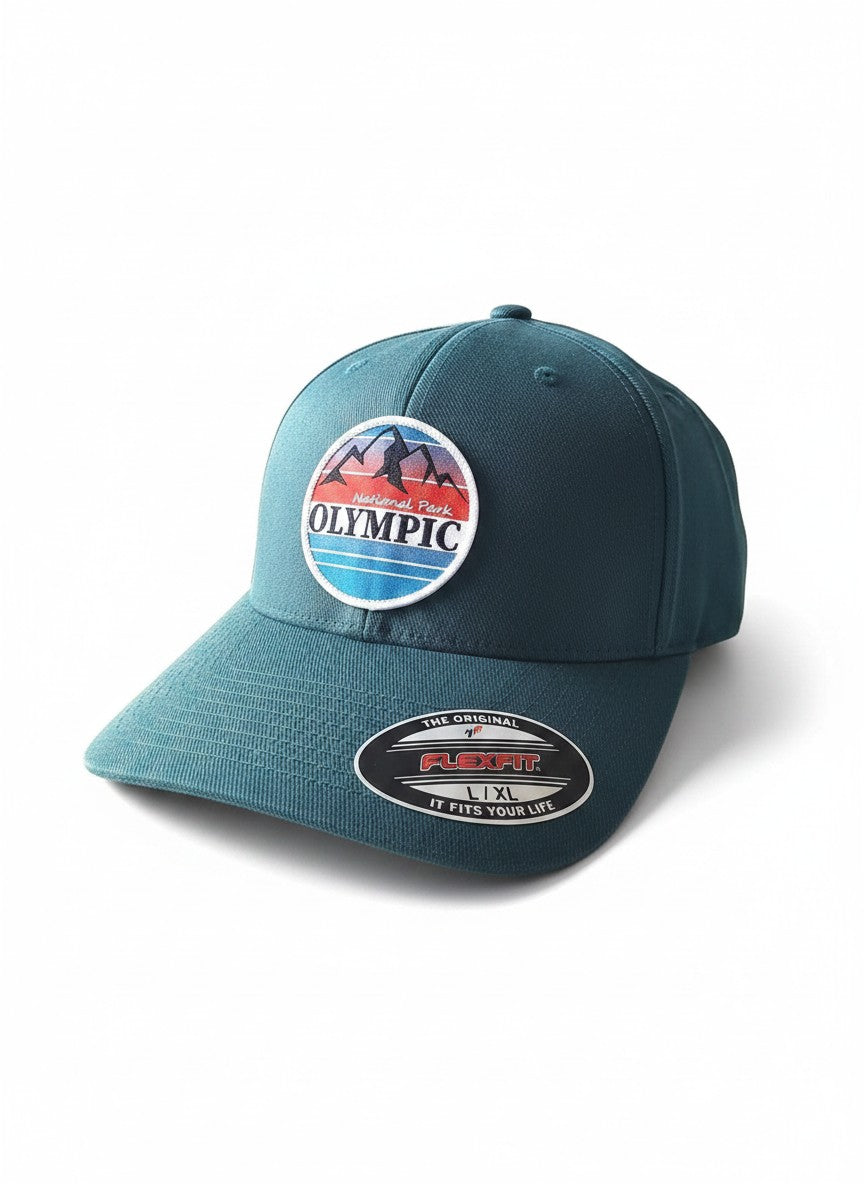 Moove Headwear teal Flexfit cap with Olympic National Park logo patch, featuring mountains and sunset.