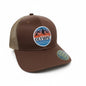 Moove Headwear brown trucker hat with mesh back and Olympic National Park mountain graphic patch. Adjustable snapback.
