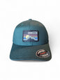 Moove Headwear Oregon baseball cap in teal with a retro mountain and sun patch. Features Flexfit technology.