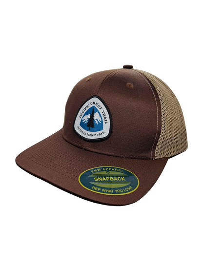 Moove Headwear brown trucker hat with Pacific Crest Trail patch and tan mesh back. Adjustable snapback closure.
