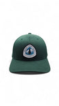 Moove Headwear dark green baseball cap with Pacific Crest Trail patch, featuring a mountain and tree graphic.
