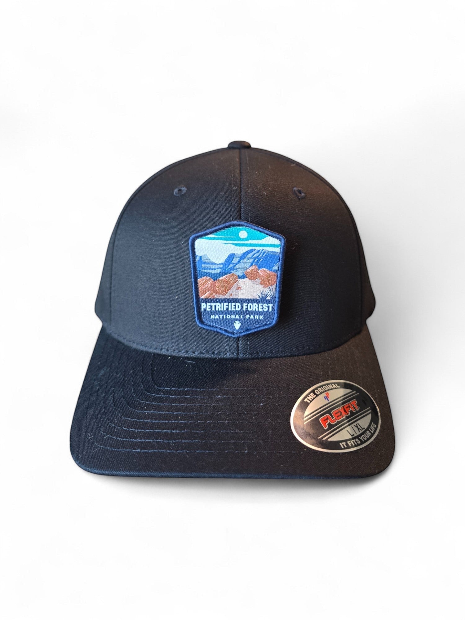 Moove Headwear Petrified Forest National Park patch on a black fitted Flexfit hat with a structured crown.