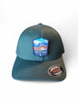 Moove Headwear teal fitted cap with Petrified Forest National Park patch featuring desert landscape and petrified wood.