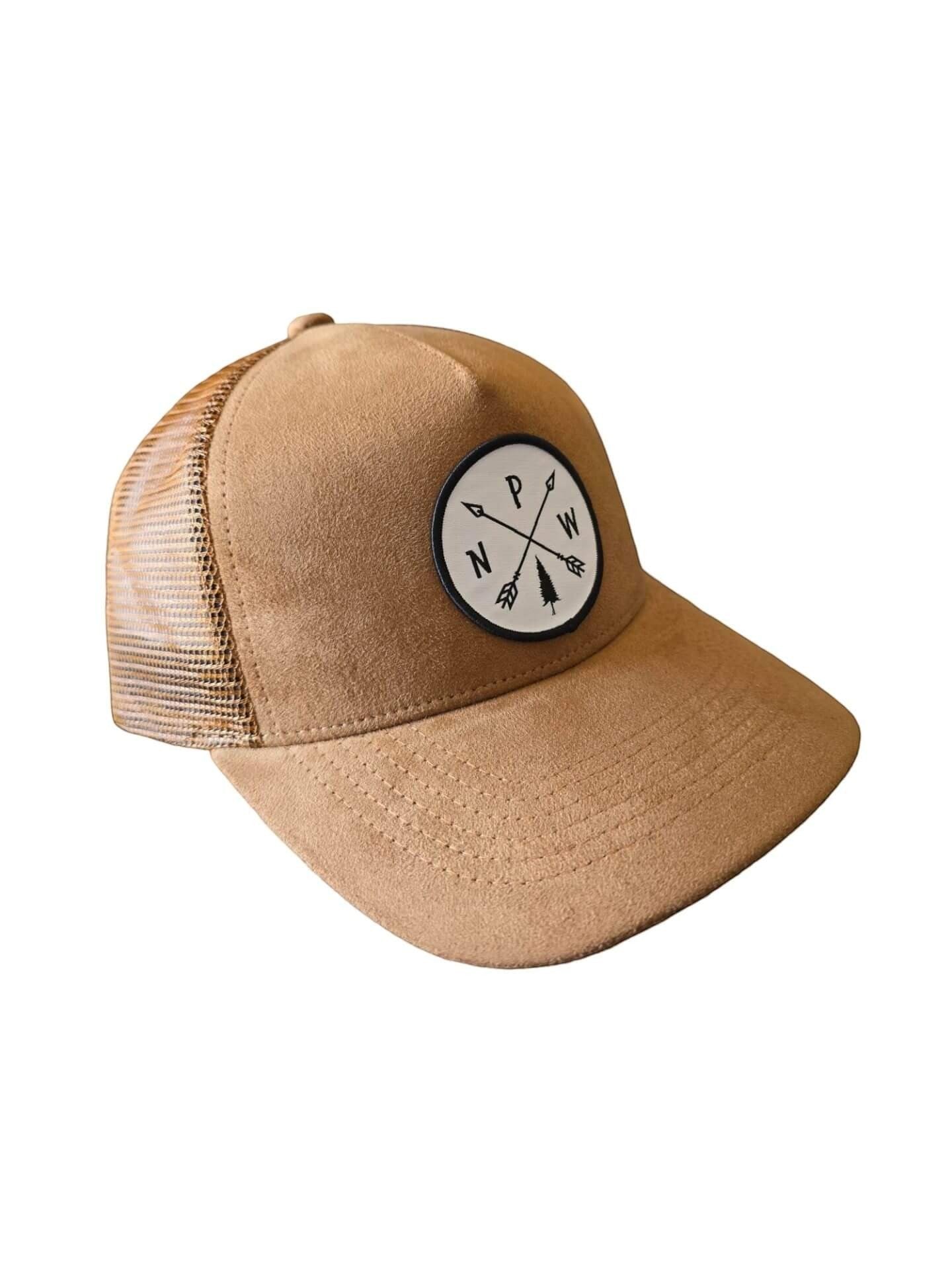 Moove Headwear tan suede trucker hat with mesh back and PNW arrow patch. Adjustable snapback.