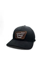 Moove Headwear black baseball cap with a brown patch logo for Pacific Northwest National Forest. Unisex Flexfit.
