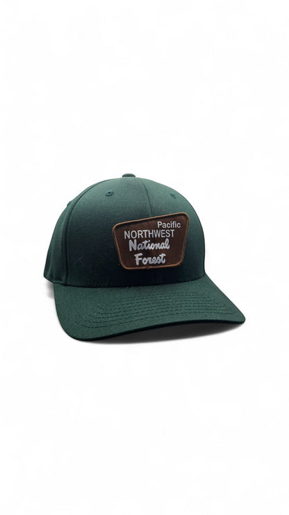Moove Headwear dark green baseball cap with a brown patch logo that reads "Pacific Northwest National Forest"