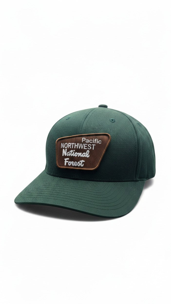 Moove Headwear dark green baseball cap with a brown patch logo reading "Pacific Northwest National Forest"