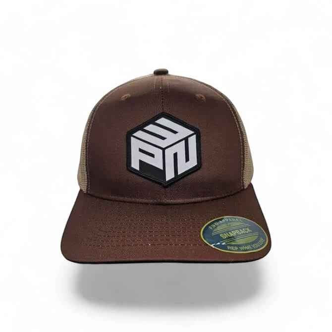 Moove Headwear brown trucker hat with a hexagonal PNW patch and tan mesh back. Adjustable snapback.