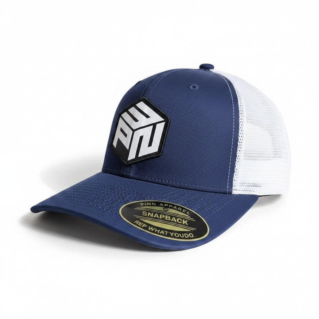 Moove Headwear navy blue trucker hat with white mesh back and PNW patch, adjustable snapback for hiking and camping.