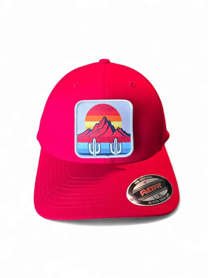 Moove Headwear red fitted hat with cactus and mountain sunset patch. Mid-profile structured crown, durable fabric.