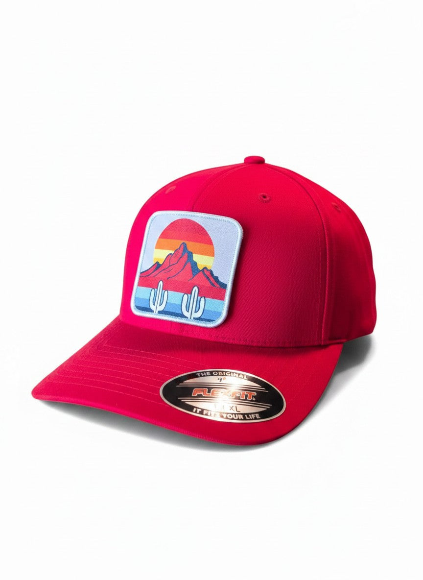Moove Headwear red fitted hat with cactus and mountain sunset patch. Mid-profile, structured crown, original Flexfit fit.