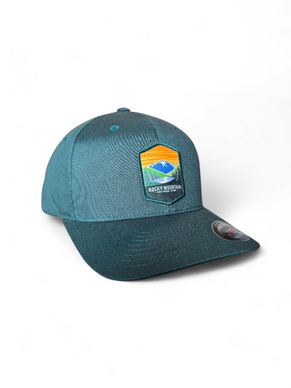 Moove Headwear teal baseball cap with Rocky Mountain National Park patch, flexible fit, breathable fabric.