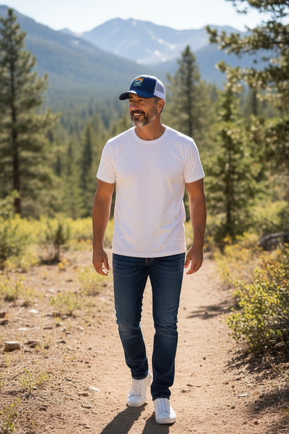 Moove Headwear navy blue trucker hat with Rocky Mountain National Park patch and white mesh back. Man wearing hat outdoors.