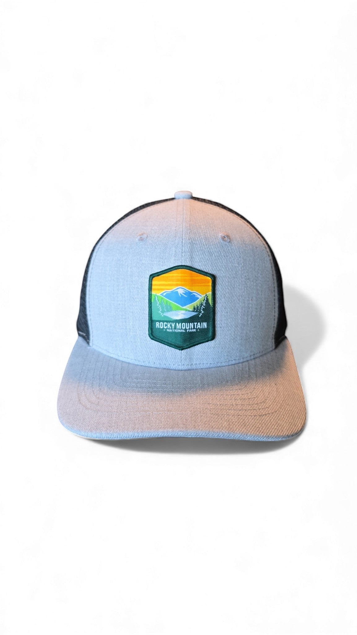 Moove Headwear light blue trucker hat with black mesh back and Rocky Mountain National Park logo patch.