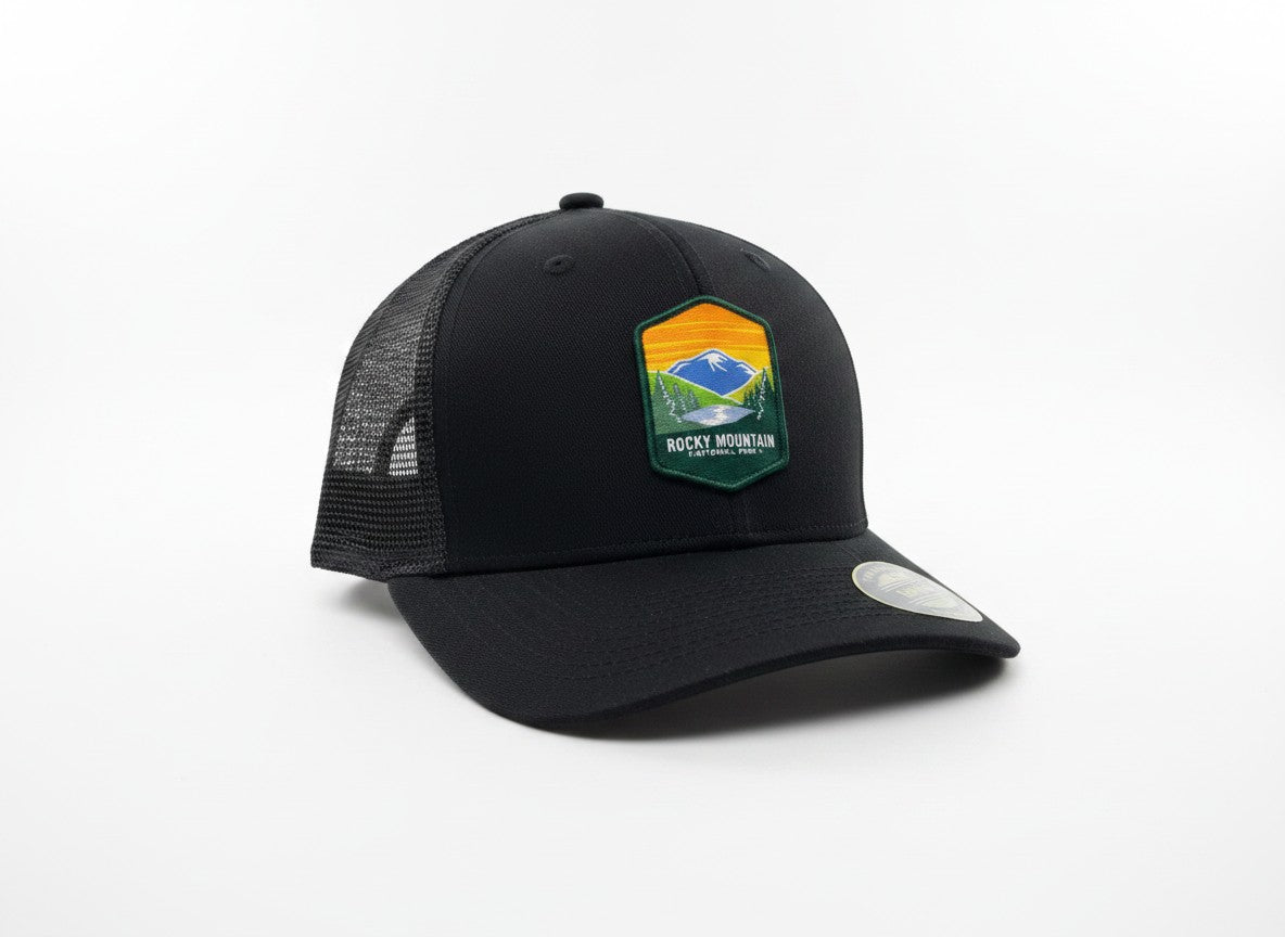 Moove Headwear black trucker hat with Rocky Mountain National Park logo patch, mesh back, and adjustable snapback.