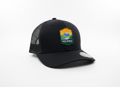 Moove Headwear black trucker hat with Rocky Mountain National Park logo patch, mesh back, and adjustable snapback.
