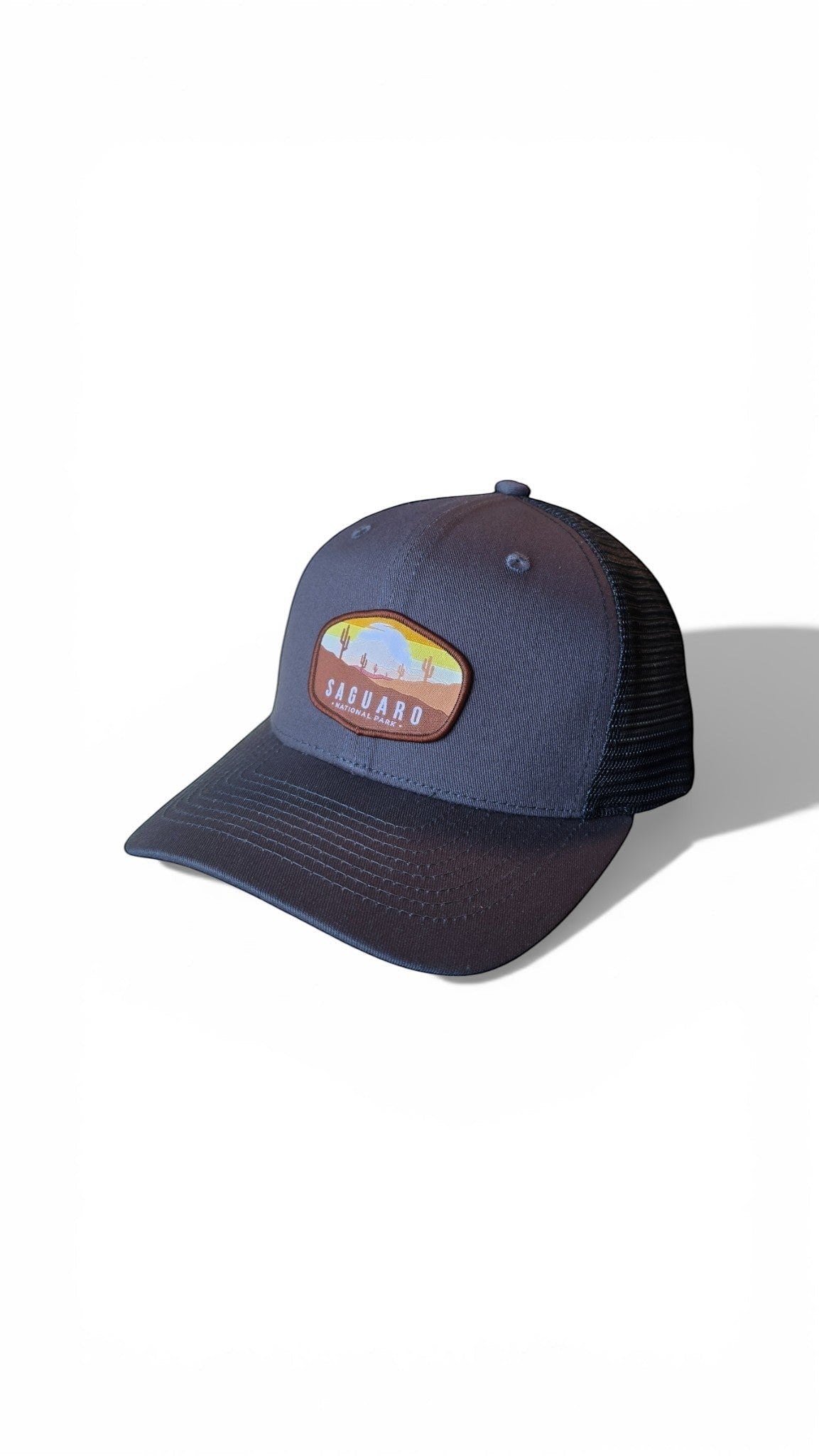 Moove Headwear navy blue trucker hat with Saguaro National Park embroidered patch and mesh back.
