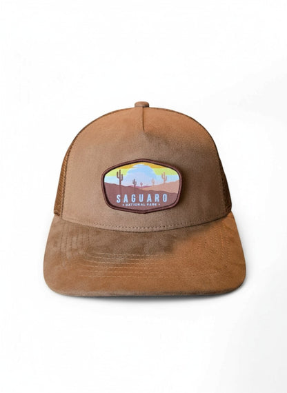 Moove Headwear Saguaro National Park trucker hat in brown suede with mesh back and desert landscape patch.