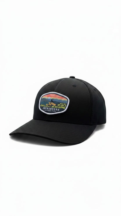 Moove Headwear black fitted cap with Shenandoah National Park patch featuring a sunset over mountains and trees.