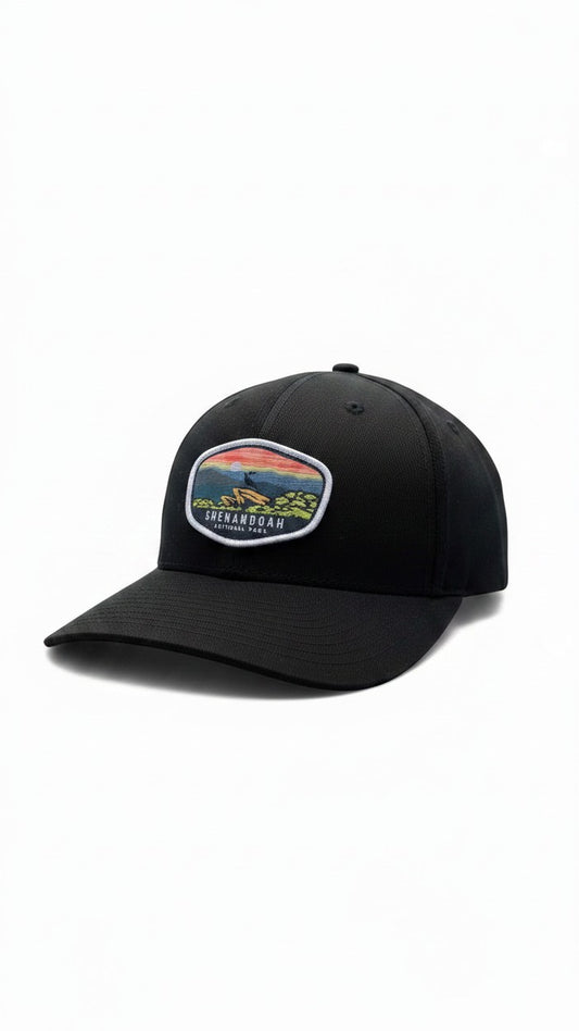 Moove Headwear black fitted cap with Shenandoah National Park patch featuring a sunset over mountains and trees.