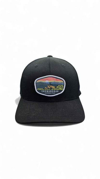 Moove Headwear black fitted cap with Shenandoah National Park sunset patch and curved brim.