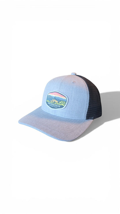 Moove Headwear light blue trucker hat with embroidered Shenandoah National Park patch and black mesh back.