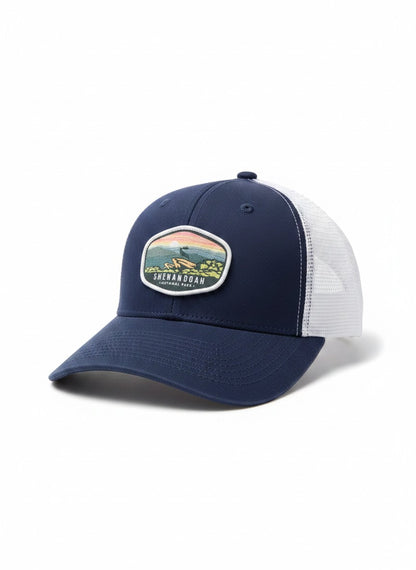 Moove Headwear navy blue and white trucker hat with Shenandoah National Park embroidered patch. Adjustable snapback.