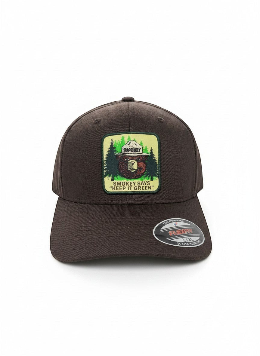 Moove Headwear brown fitted baseball cap with Smokey Bear emblem and "Keep It Green" slogan.