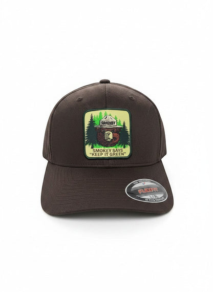 Moove Headwear brown fitted baseball cap with Smokey Bear emblem and "Keep It Green" slogan.