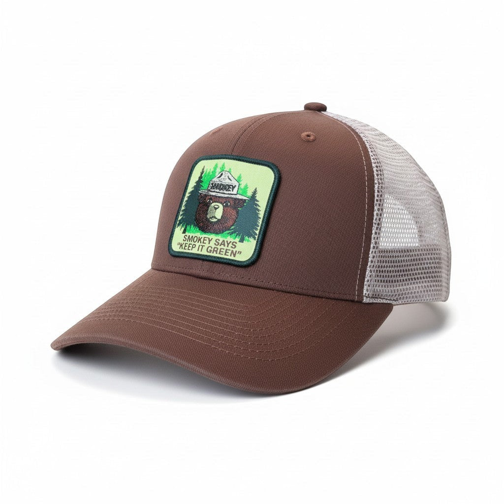 Moove Headwear brown trucker hat with mesh back and Smokey Bear patch saying "Keep It Green"