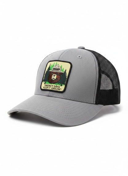 Moove Headwear grey trucker hat with black mesh back and Smokey Bear patch saying "Keep It Green"