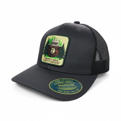 Moove Headwear dark grey mesh back trucker cap with Smokey Bear logo patch promoting fire safety.