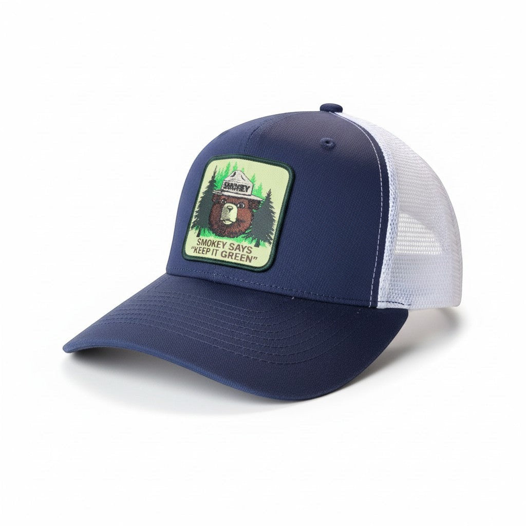 Moove Headwear navy blue trucker hat with white mesh back and Smokey Bear patch that says "Smokey Says 'Keep It Green'"