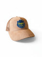 Moove Headwear tan suede trucker hat with mesh back and PNW Apparel mountain patch. Adjustable snapback for universal fit.