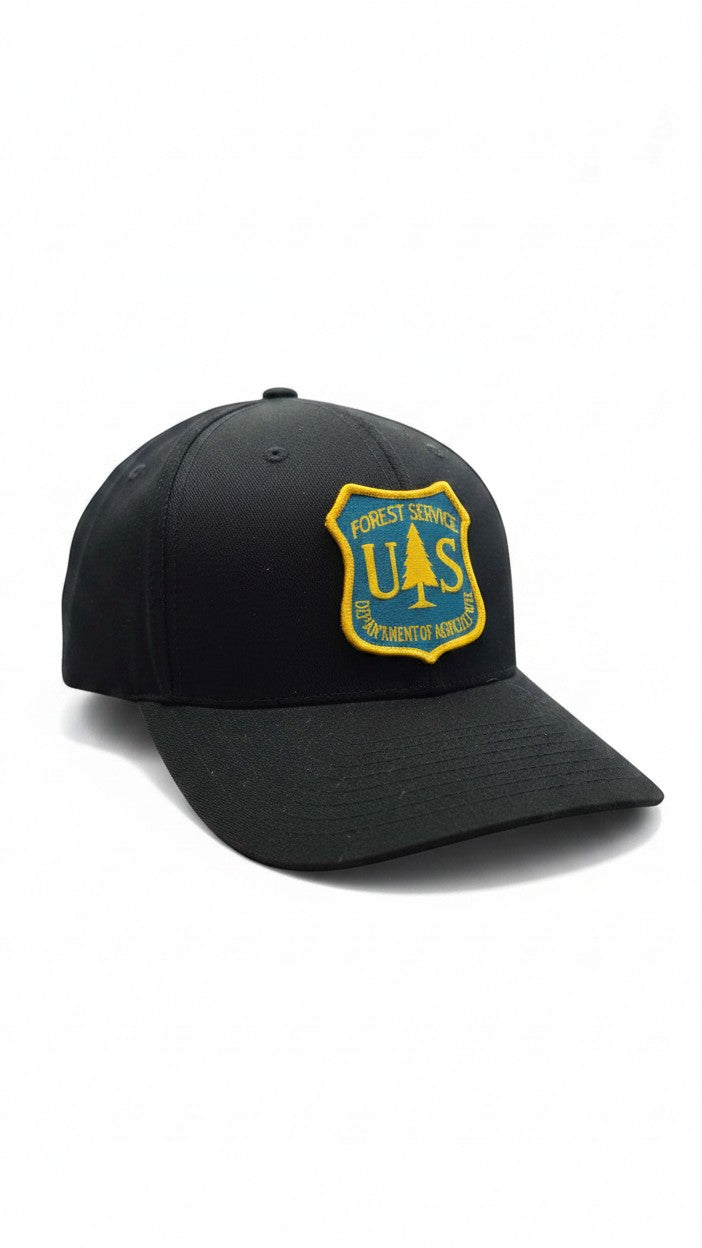 Moove Headwear black fitted cap with US Forest Service patch, 6-panel, curved brim.