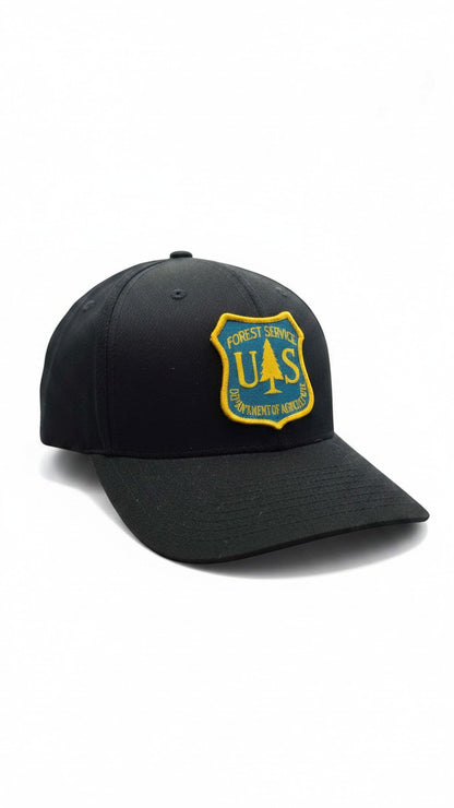 Moove Headwear black fitted cap with US Forest Service patch, 6-panel, curved brim.