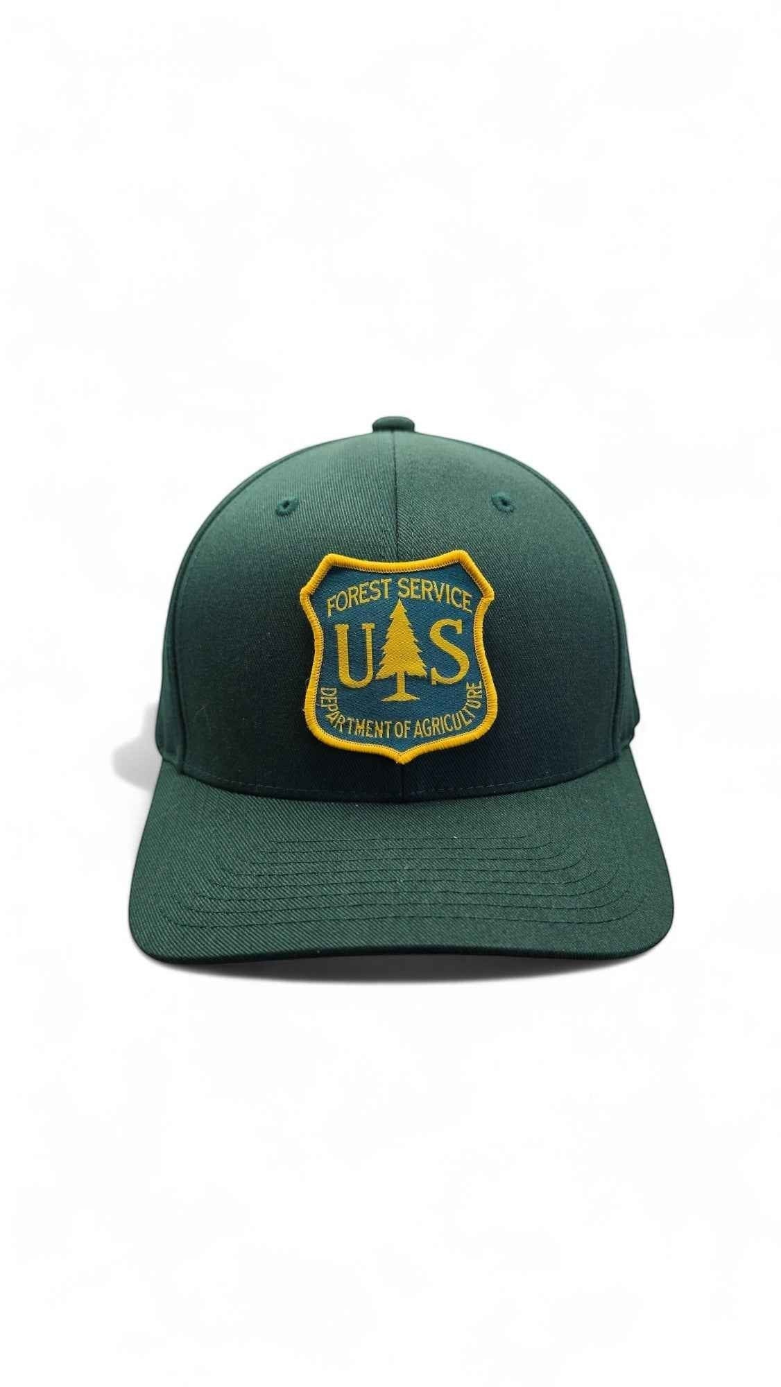 Moove Headwear dark green fitted cap with US Forest Service patch, curved brim, and 6-panel design.