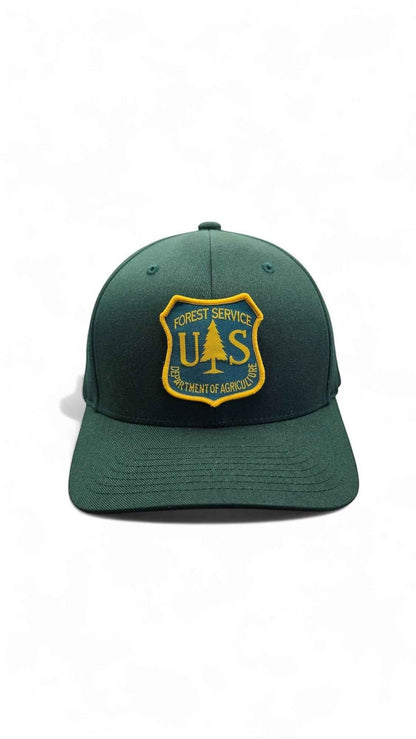 Moove Headwear dark green fitted cap with US Forest Service patch, curved brim, and 6-panel design.