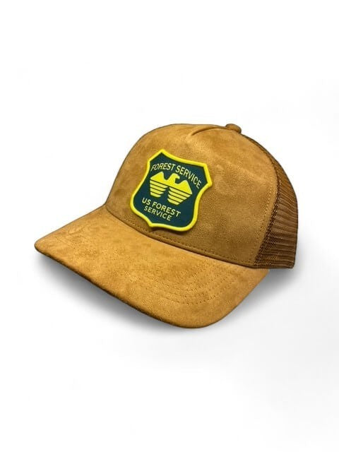 Moove Headwear USFS Ranger Trucker Hat in tan suede with mesh back and embroidered US Forest Service patch.
