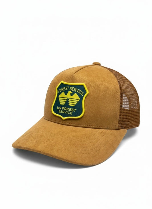 Moove Headwear USFS Ranger Trucker Hat in tan suede with mesh back and embroidered US Forest Service patch.