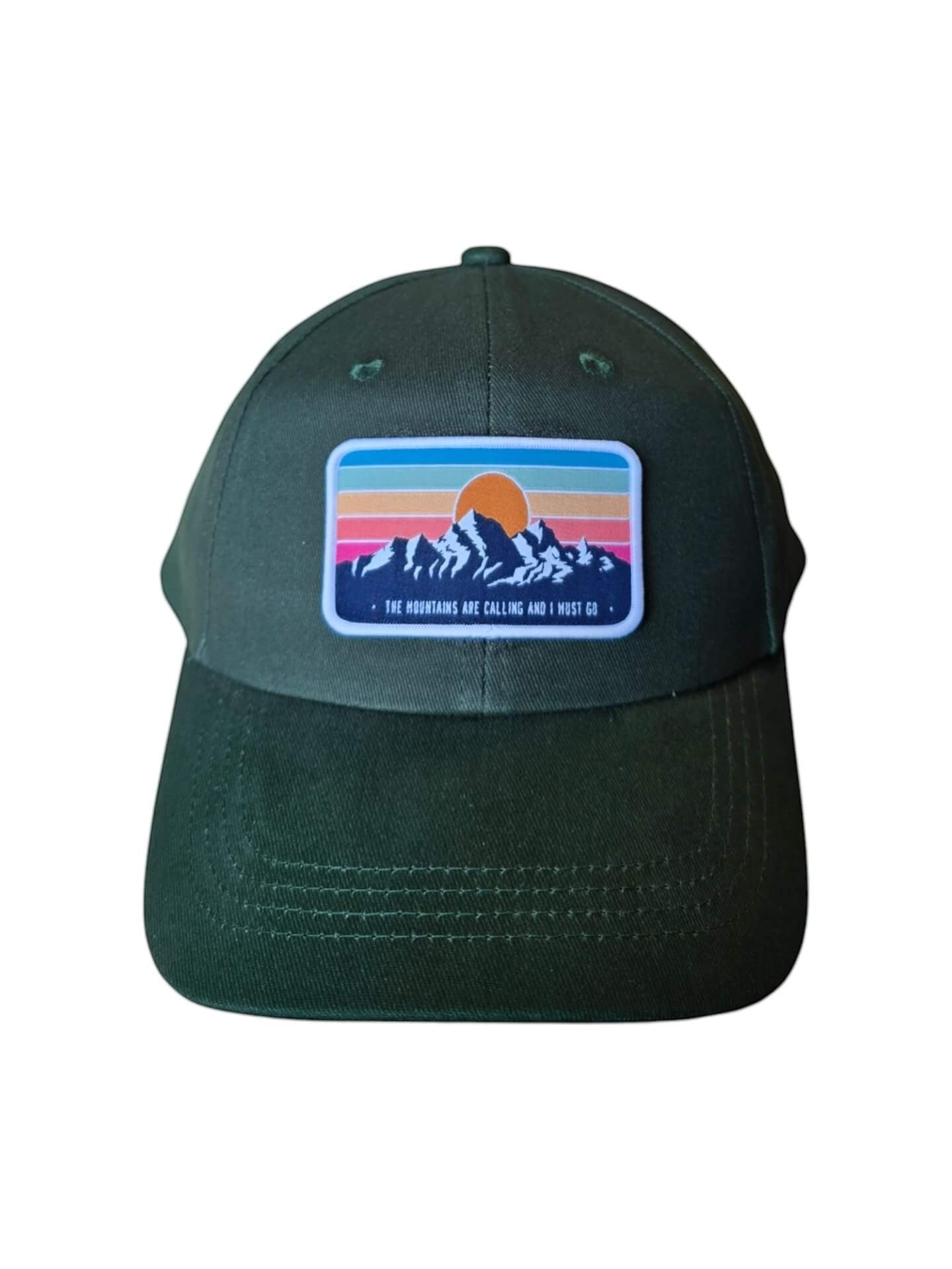 Moove Headwear dark green dad hat with a retro mountain sunset patch. Adjustable brass buckle and hook and loop closure.