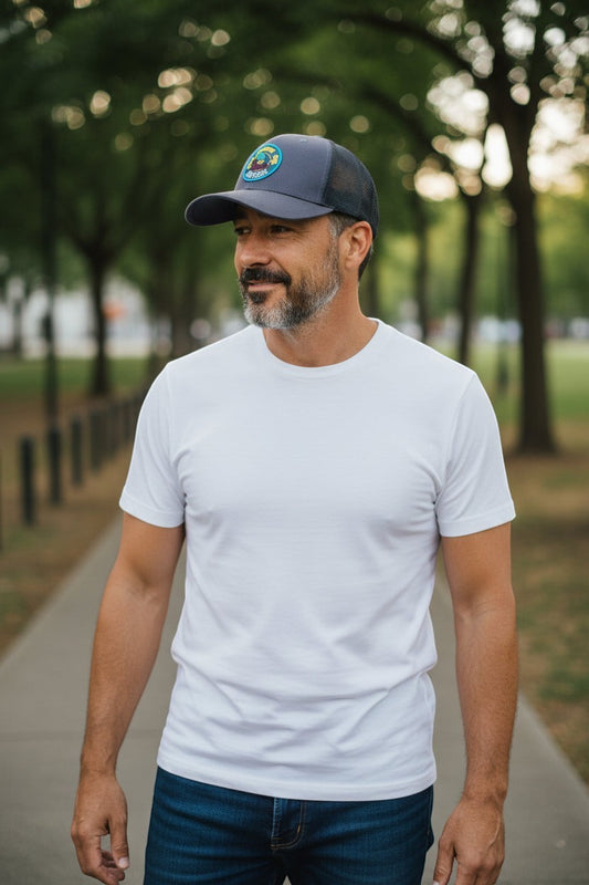 Moove Headwear Woodsy Owl trucker hat with mesh back and adjustable snapback closure, featuring a conservation graphic.