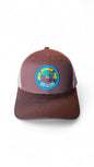Moove Headwear brown trucker hat with mesh back and Woodsy Owl graphic patch promoting conservation.