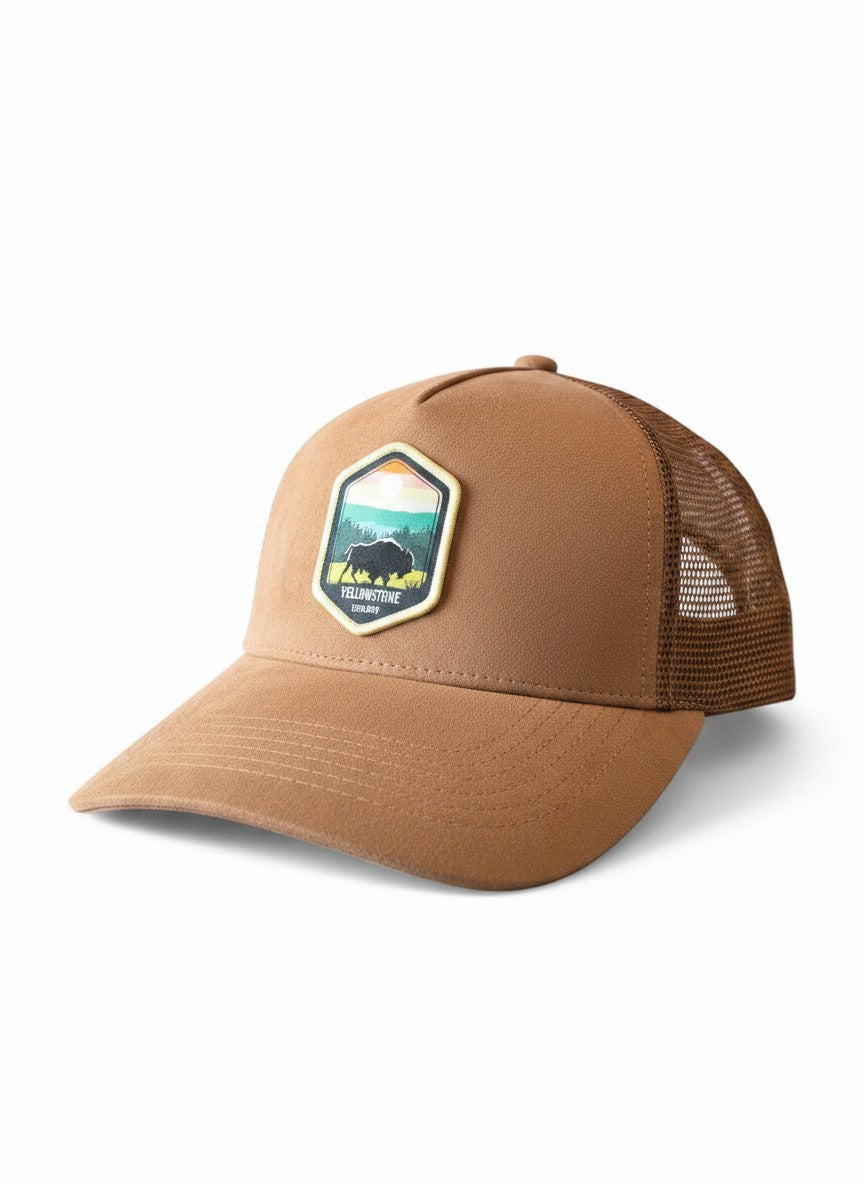 Moove Headwear tan suede trucker hat with Yellowstone National Park buffalo emblem and mesh back.