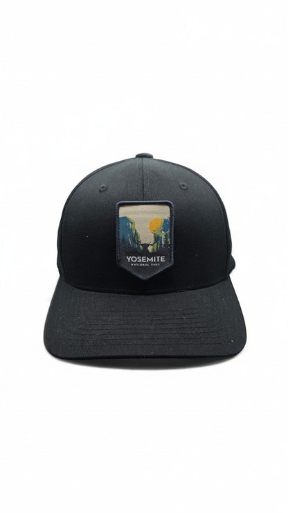 Moove Headwear black fitted cap with Yosemite National Park embroidered patch featuring a scenic landscape and deer.
