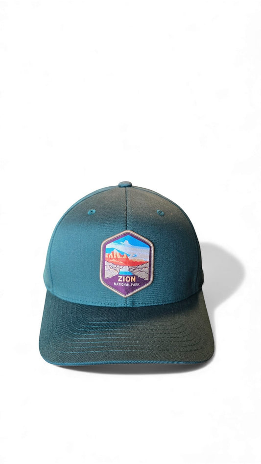 Moove Headwear teal adjustable baseball cap with embroidered Zion National Park patch, featuring mountains and a river.